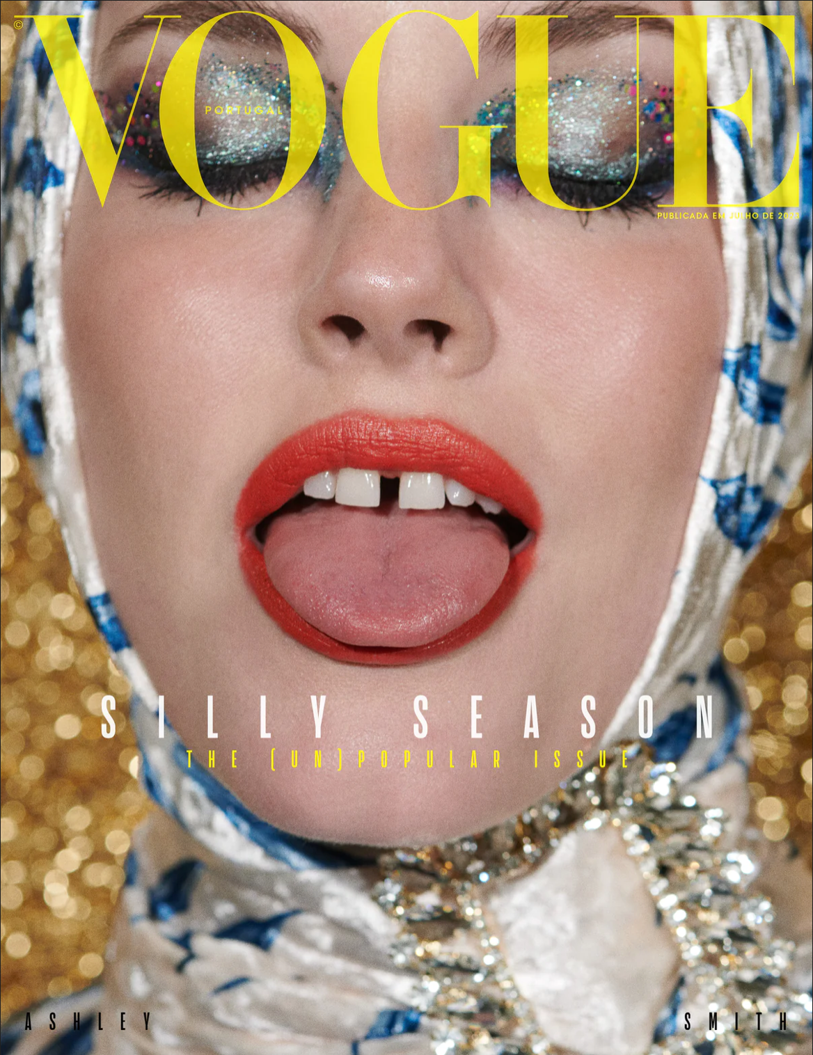 Cover of Vogue Magazine Portugal with the model's face up close and tongue sticking out.
