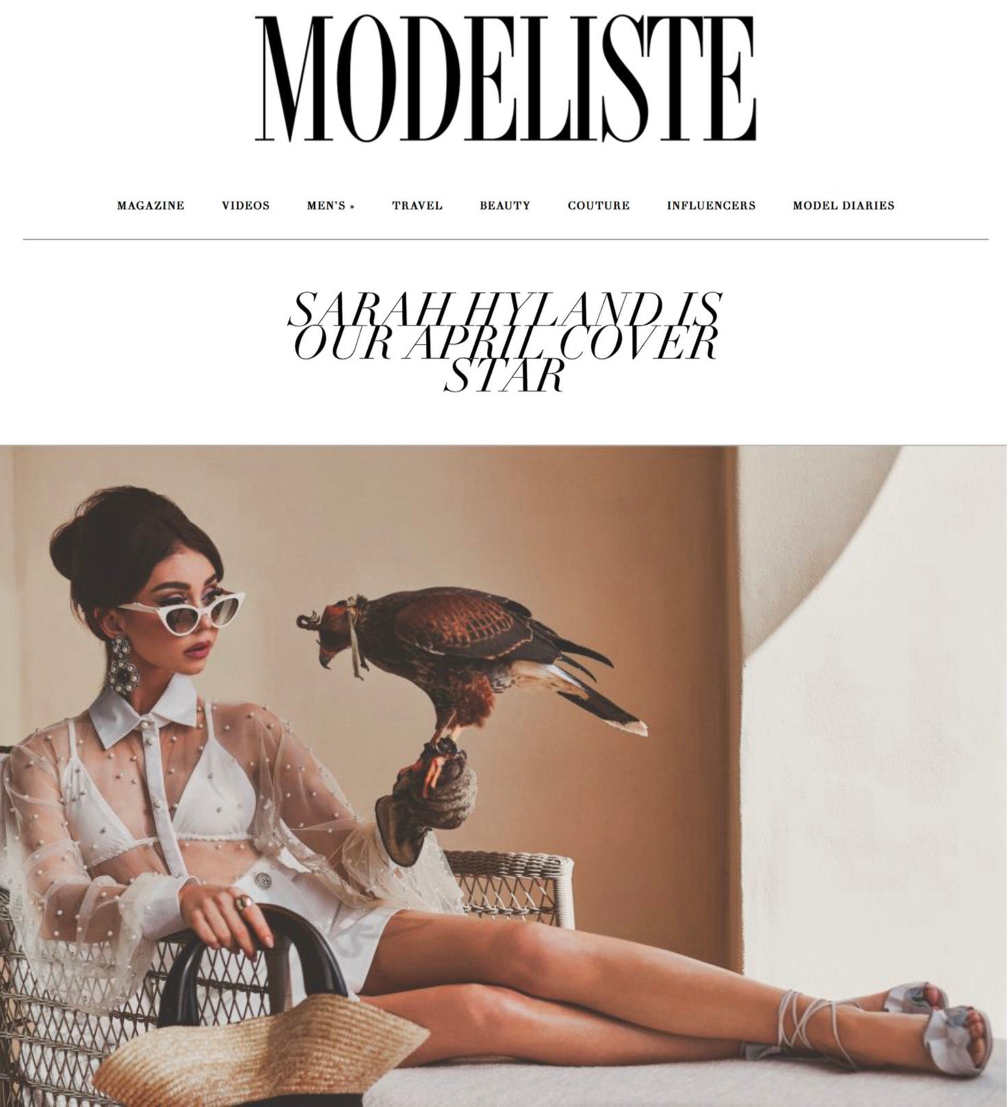 Excerpt from Modeliste Magazine with Sarah Hyland holding a hawk on a lounge chair